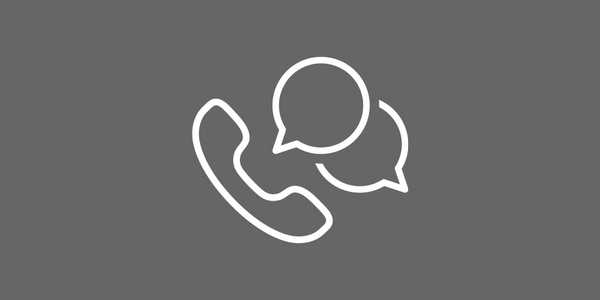 White outline of a telephone and two speech bubbles on a gray background.